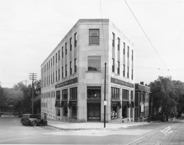 The Montgomery Ward Store Building at 100 North Hamilton Street, at the intersection of Pinckney and North Hamilton Streets. The building was designed by Law, Law, and Potter in 1929 and is made of Bedford limestone.
