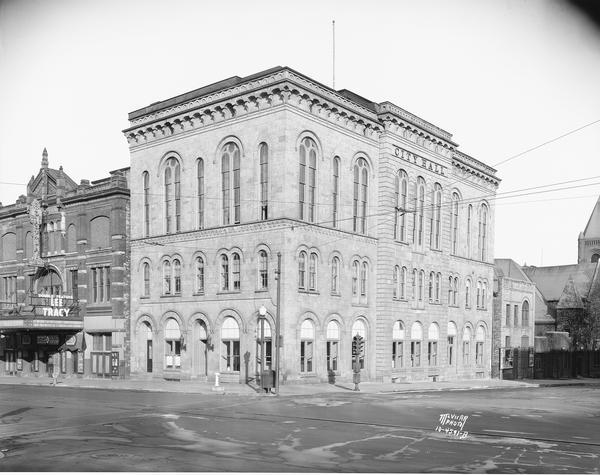 Madison's City Hall, erected in 1858, and designed by Samuel Hunter Donnel and August Kutzbock. The Parkway Theatre is next door on the left.
