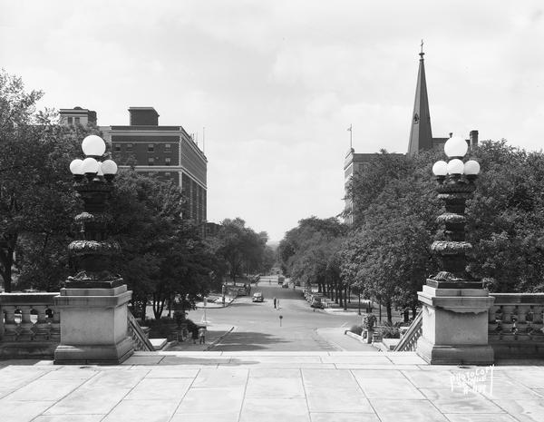 View of West Washington Avenue from the Capitol steps, with the Grace Episcopal Church steeple on the right.