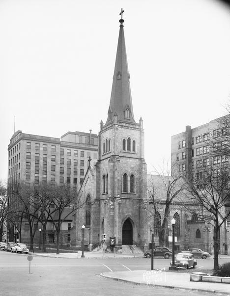 Built in 1855 and designed by Milwaukee architect James Douglas, the Grace Episcopal Church is the oldest remaining building on the Capitol Square. Grace Episcopal Church is at 6 North Carroll Street, with Wisconsin Power and Light Building, 122 West Washington Avenue, and Gay Building, 16 North Carroll Street, in the background.
