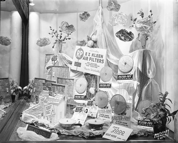 Research Products Company display window at Wolff-Kubly & Hirsig Hardware Store, featuring Filter-Fry frying pan cover and E Z Kleen air filters. 17 South Pinkney.