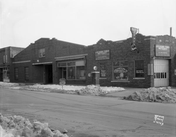 Exterior of the J.R. Licari & Son garage, located at 767 West Washington Avenue. The view also includes Trotters Billiards, located at 763 West Washington Avenue. Greenbush neighborhood.