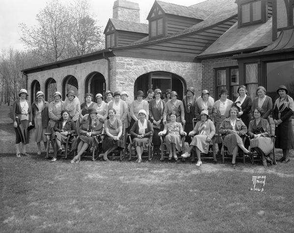 Group portrait of women golfers in street clothes outdoors at the Nakoma Country Club, 4145 Country Club Road.
