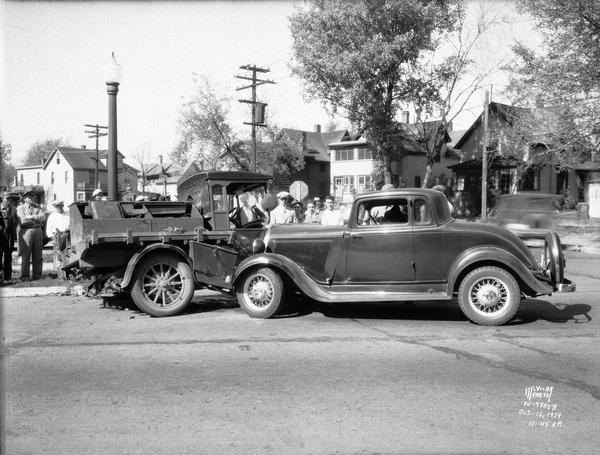 Automobile and truck crash at the corner of Milton and West Washington Avenue in the Greenbush neighborhood. Houses in the 600 block of Milton Street are in the background.