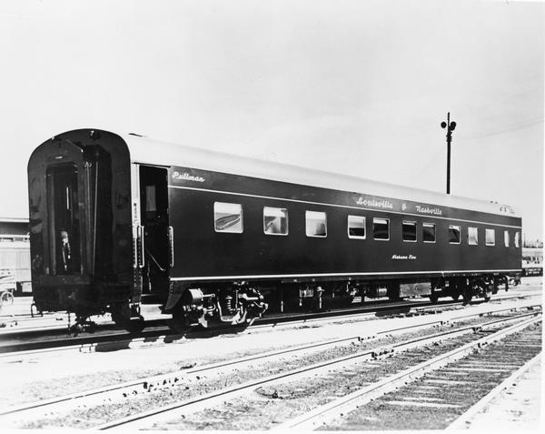 A sleek, deluxe sleeping railroad passenger car made of high-strength, low-alloy steel.