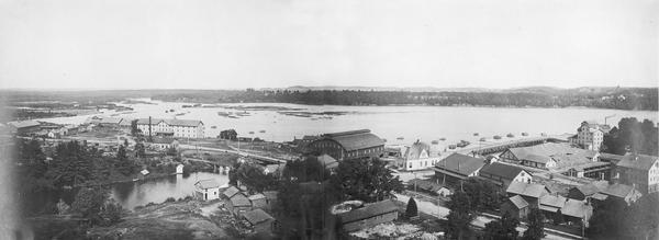 Menomonie at the turn of the century, view of the river and town.