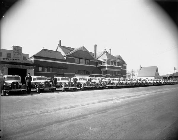 Line up of City Cabs in front of the J. Heilprin & Co. Wholesale Fruits & Groceries, 612 W. Main Street, formerly the Illinois Central Passenger Depot.