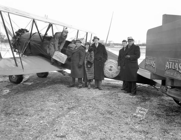 In an obvious publicity stunt, a Northwest Airways pilot delivers the first case of post-Prohibition Atlas Beer to Madison distributor Ira Chambers. The shipments from Atlas Brewing Co. in Chicago went to President Franklin Roosevelt and other prominent individuals, and they constituted the largest airplane shipment to date.