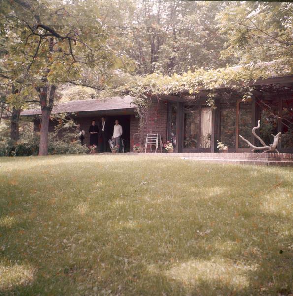 South elevation of the Malcolm Willey residence showing a portion of the carport, the terrace, the gardens, and the glass wall of the living room.  The Willey residence was designed by Frank Lloyd Wright.
