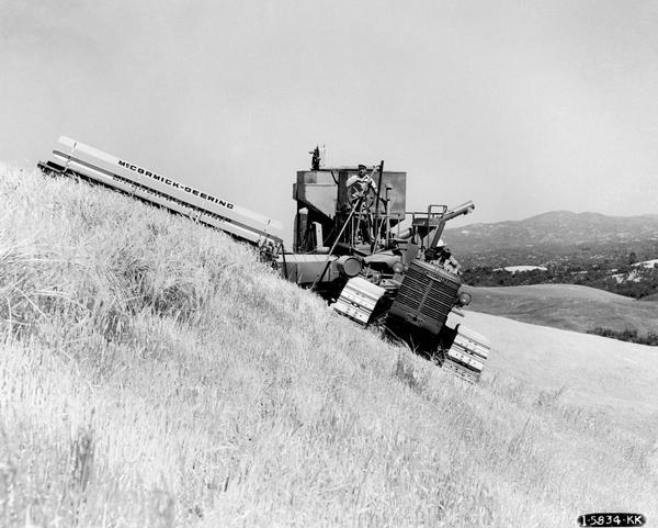 Farmers harvesting barley with an International TD-14 diesel crawler tractor and a McCormick-Deering No. 51 harvester-thresher (combine) on the farm of Heilmann Brothers. The machines are shown operating at a 60 percent grade.