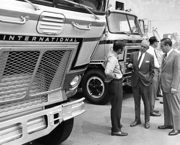 View of delegates talking trade in front of International trucks at the Regular Common Carrier Conference in Memphis, TN.