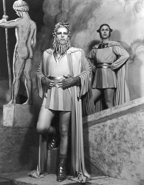 Alfred Lunt as Jupiter with actor Richard Whorf standing behind him.