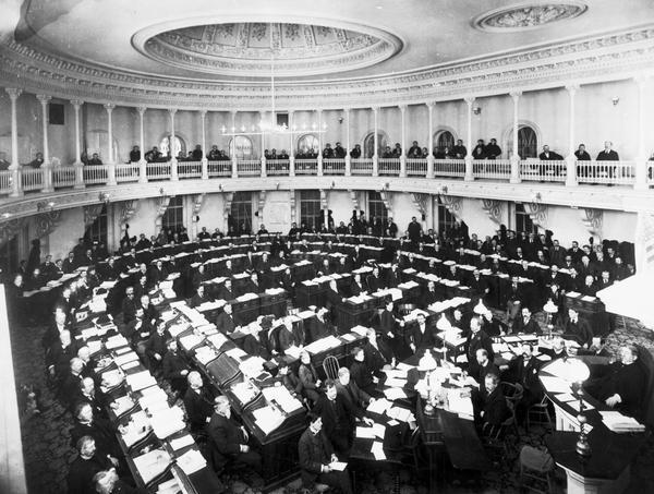 The Wisconsin State Assembly in session in the second Wisconsin State Capitol, with observers looking on from the gallery.