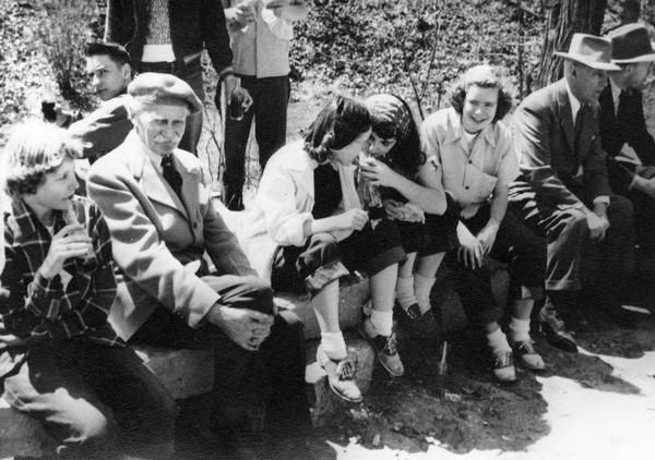 Landscape architect Jens Jensen and youth from the Madison Youth Council at Glenwood Children's park on their clean-up work day. The park was planned and designed by Jensen in 1942 and became a part of the Madison Parks and Playground system in 1943.