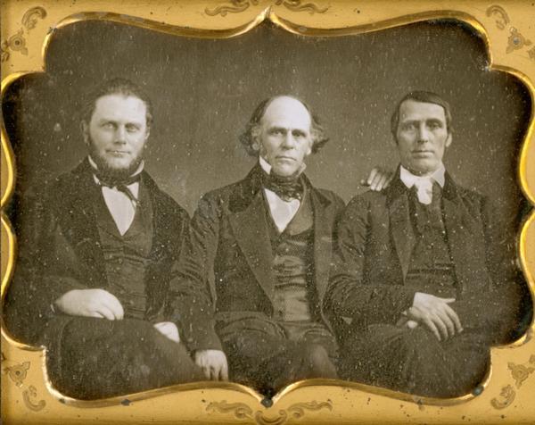 Half plate daguerreotype of E. Harwood, Dr. William Brisbane, and Levi Coffin, sitting in a row.