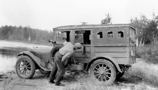 Dr. Edward Ashael Birge reading a sun machine inside a car. In 1875 Dr. Birge first came to teach natural history at the University of Wisconsin, and remained part of the institution for the next 75 years. He contributed much to the university, including work as Dean of the College of Letters and Sciences, president, and research in limnology. Dr. Birge was also the curator of the State Historical Society of Wisconsin from 1936-1946.