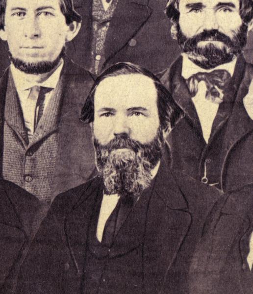 Portrait of William Pitt Lynde at the Wisconsin Assembly in 1866. Ten years later he introduced legislation for women's suffrage to U.S. Congress. In the background, A. Dieringer can be seen on the left, and N. Dittmar on the right.