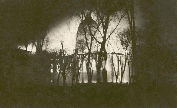 View of the Wisconsin State Capitol fire of February 26-27, 1904 from East Main Street at about 4:00 a.m. The East and West wings were destroyed, as was much of the central rotunda and the South Wing. The undamaged North Wing continued to be used during the construction of the Fourth Capitol.