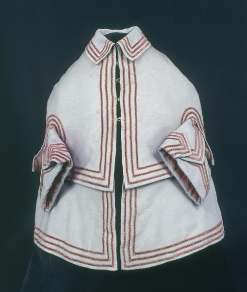 Front view of girl's faded gray coat with red velvet trim. Worn by Jane Larned (Williamson) Hague (born 1819) in Pittsburgh, Pennsylvania.