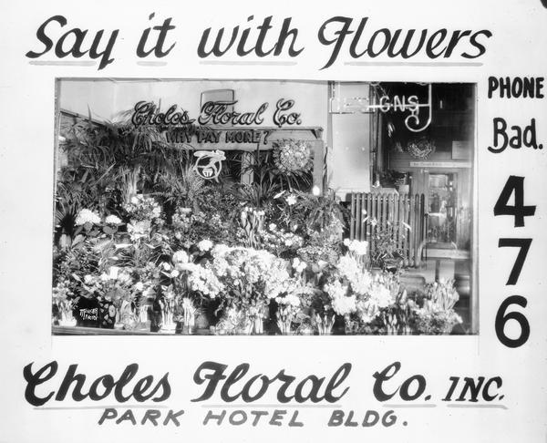 Advertisement for Choles Floral Co., 22 S. Carroll showing a floral window display.