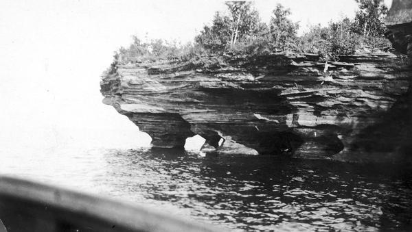 Devils Island on Lake Superior, outermost of the Apostle Islands group. There appears to be the edge of a boat in the foreground.