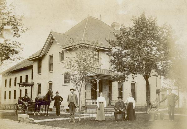 Sheriff John MacKenzie poses in front of the Portage jail with his staff.