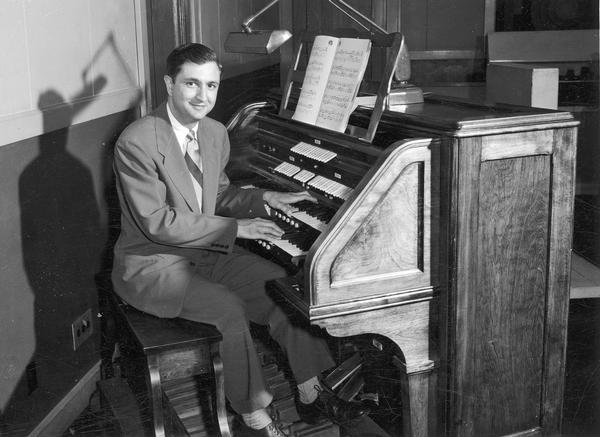 Don Voegeli seated at an organ.