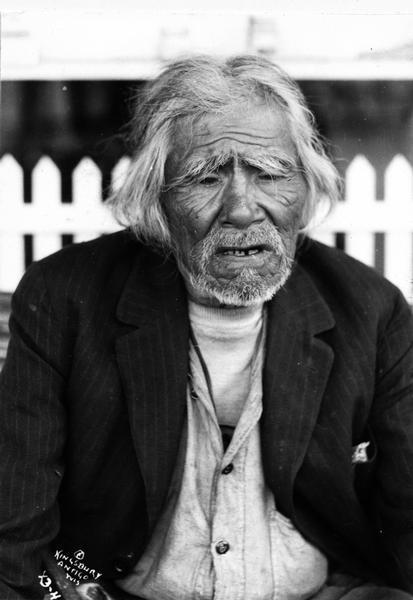 Mr. Bearskin, a medicine man, at Lac du Flambeau, Wisconsin. This image is part of an exhibit about Native Americans prepared by Paul Vanderbilt, first curator of photograpy at the Wisconsin Historical Society.