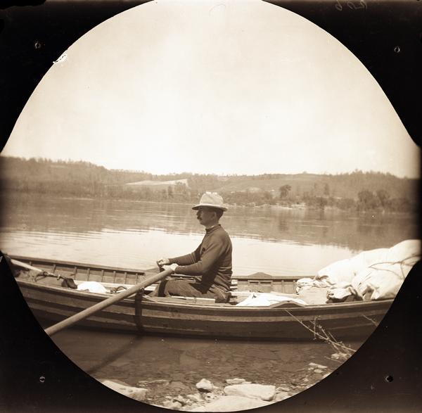 Reuben Gold Thwaites rowing the skiff the "Pilgrim" on the Ohio River.