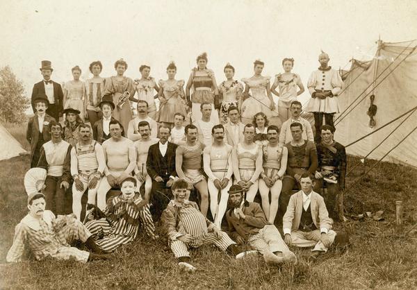 Personnel of the Walter L. Main show in 1904 and 1905, photographed outside a tent, include clowns, the driver of a four horse chariot, and air performers. Their contemporary, circus man Frank B. Miller, described the group as "A bunch of real old time actors, all damn good ones..."