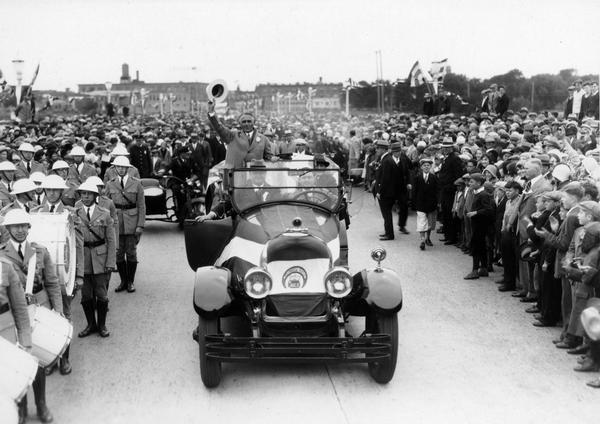 Governor Walter J. Kohler, Sr., riding in an open car during a parade, probably in Marinette.