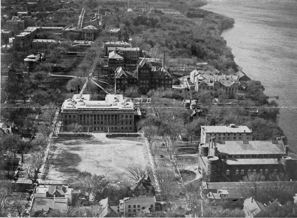 Originally titled 'Recent Aeroplane View of University Campus', the view of the Wisconsin Historical Society, the Red Gym, Science Hall and Bascom Hall with Lake Mendota on the right on the University of Wisconsin-Madison campus.