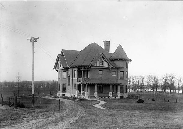 View of the University of Wisconsin residence of William Arnon Henry, Dean of Agriculture, 10 Babcock Drive with Lake Mendota in the background.