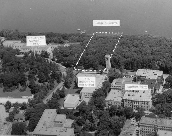 Aerial view of upper campus on the University of Wisconsin-Madison. Typewritten labels mark the location of Elizabeth Waters Hall, New Commerce Building, Lake Mendota and Bascom Hall.