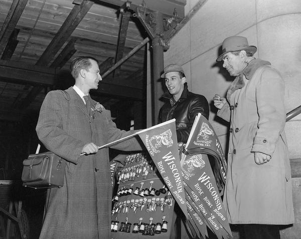 University of Wisconsin football fans get their Badger memorabilia on the way to the Rose Bowl played January 1st, 1953.