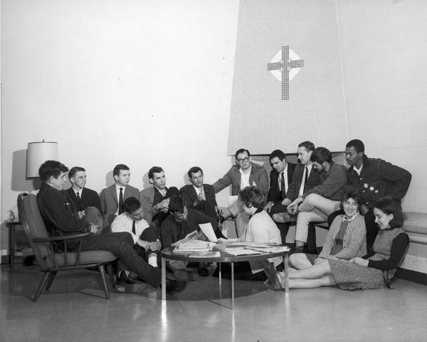Founding members of the Southern Students Organizing Committee (SSOC) at a committee meeting, discussing ways to organize white students in the South to promote equality and justice for all people. Seated on floor, left to right: Dan Harmeling, Harry Boyte, Sue Thrasher, Cathy Cade, Marjorie Henderson. Top row, left to right: Sam Shirah, Jerry Gainey, Roy Money, Gene Guerrero, Ed Hamlett, Jim Williams, John Shively, Bob Potter, Bob Richardson, Marion Barry, Jr.