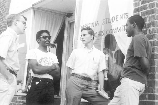 Four Virginia State University male students stands outside the Virginia Students Rights Committee office.