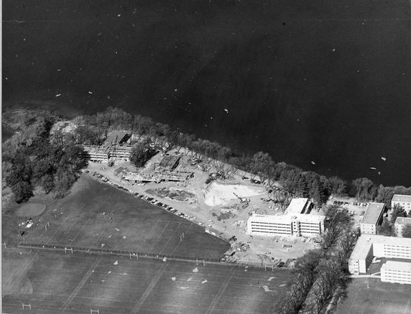 Aerial view of the construction of the lakeshore dormitories, the recreation facilities and Lake Mendota on the University of Wisconsin Madison campus.