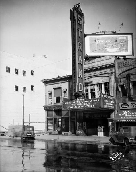 The exterior of the Fox Strand Theatre on Mifflin Street, with the marquee advertising the "The Arizona Kid."