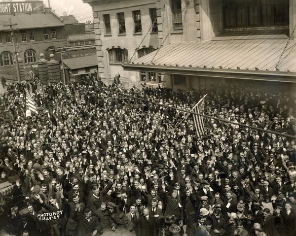 Elevated view of draftees at the Northwestern depot on their way to basic training and then France. Nearly 3,000 Madison men joined the war effort.