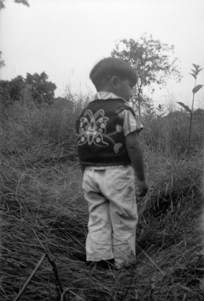 Unidentified boy, probably at Winnebago (Ho-Chunk) Indian Village.