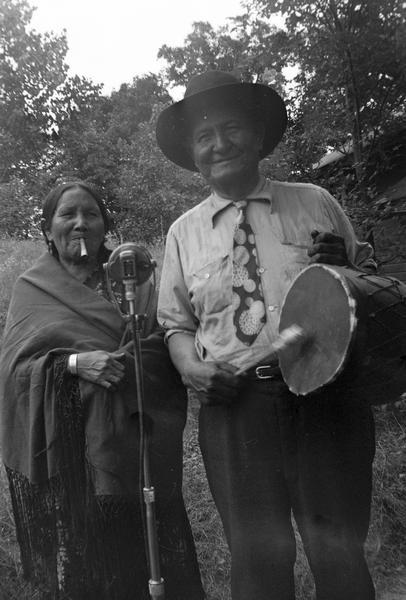 Mr. and Mrs. James Hawkins or Henry Thunder and Stella Stacy. Probably at Winnebago (Ho-Chunk) Indian Village.