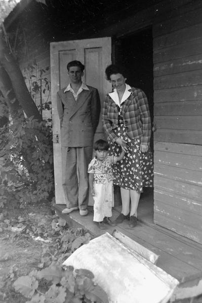 Helene Stratman-Thomas with an unidentified man and child, possibly at Winnebago (HoChunk) Indian Village.