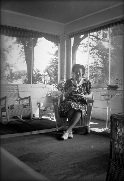 Helene Stratman-Thomas, possibly at the home of Donalda La Grandeur, a singer of French-Canadian songs who recorded for Stratman-Thomas.
