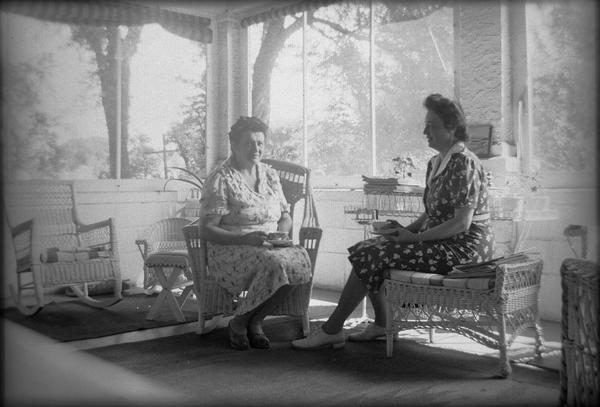 Singer Donalda La Grandeur, left, and collector Helene Stratman-Thomas on the porch at the home of La Grandeur.