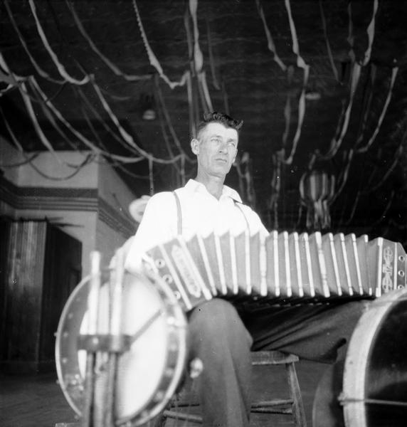 Joe Yansky (Bohemian), a one-man band with an accordion and drums.