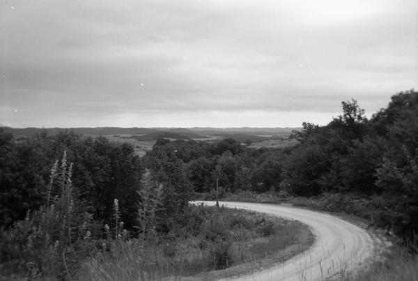 A Wisconsin landscape with a road in the foreground.