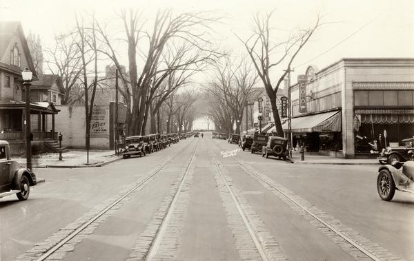 View of State Street towards Bascom Hill, with Schaeffer's Lavernette, a soda fountain, Student's Book Exchange, and the University Coop.