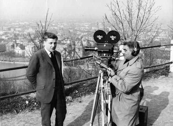 Foreign correspondent, Russell Jones, on assignement. Jones worked for ABC News, and is being filmed for an evening news segment on political events in Budapest, Hungary.