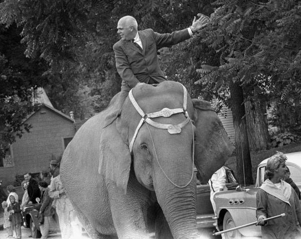 Wisconsin Lieutenant Governor Philleo Nash, a Democrat, riding on an elephant during the annual Circus Parade.
